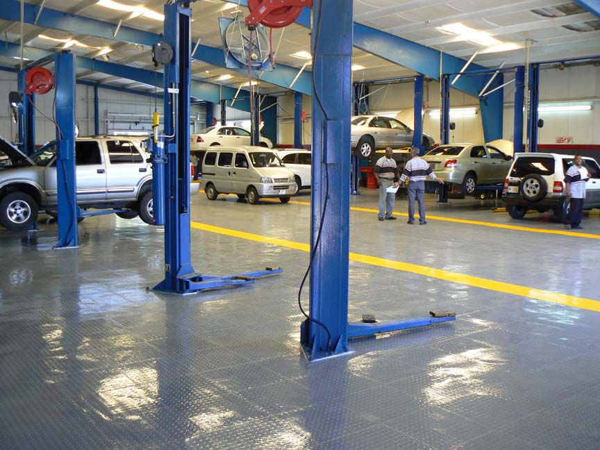 Interlocking ArmorGarage floor tiles installed in a repair shop
