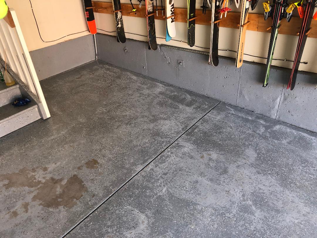 Worn, stained garage concrete before ArmorGarage epoxy coating