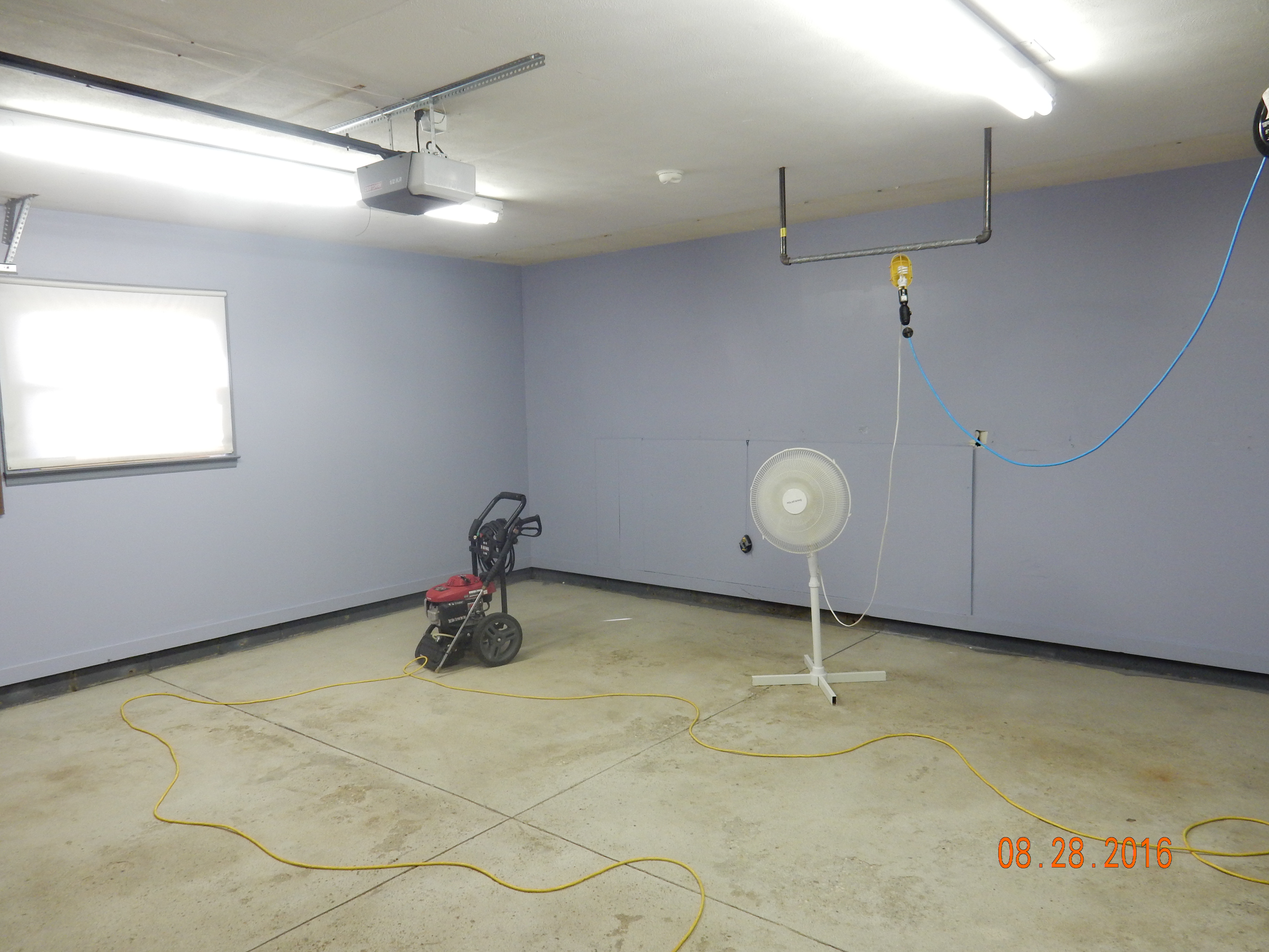 Old, discolored garage concrete before resurfacing