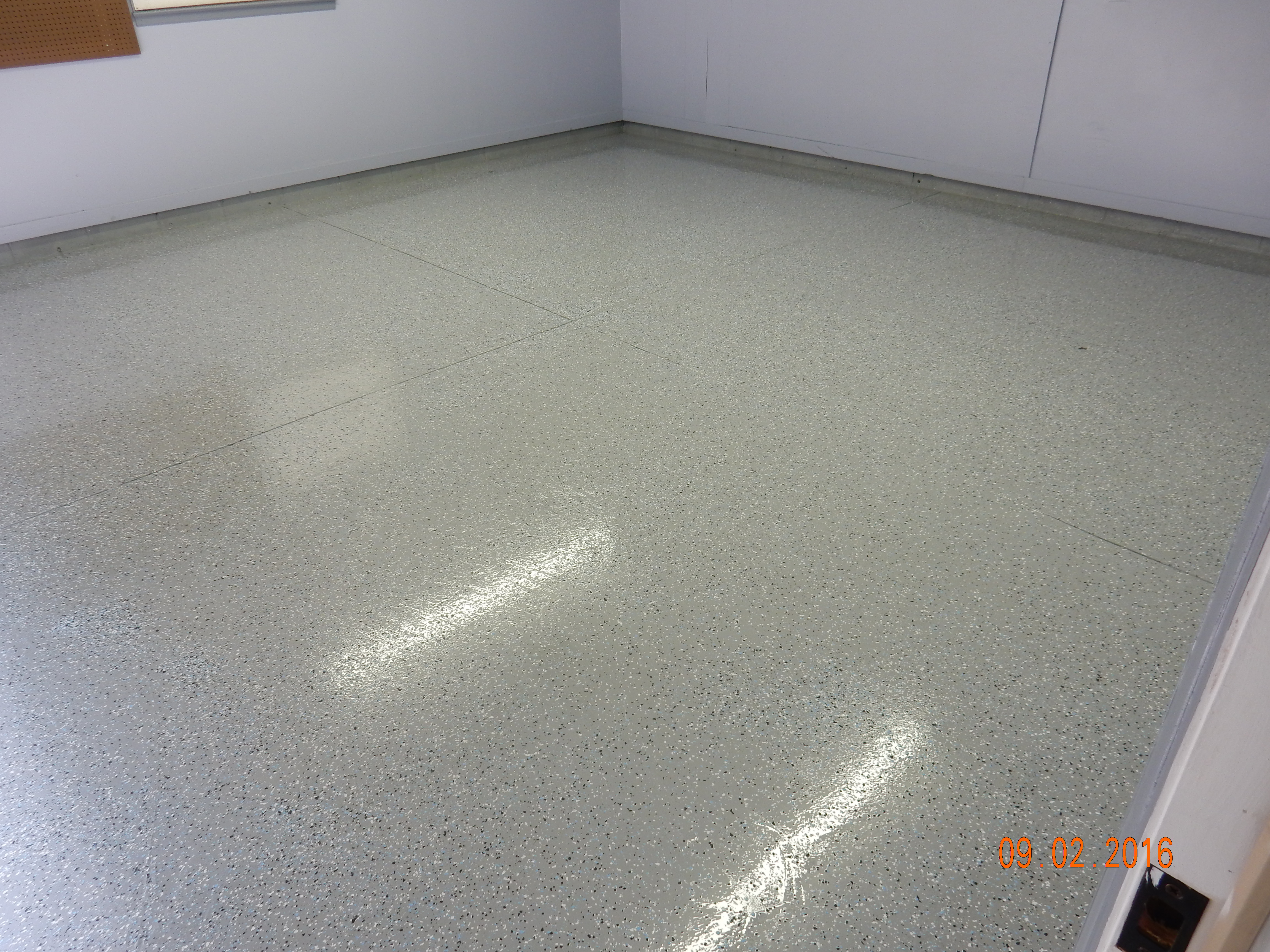 Decorative ArmorGarage epoxy chip floor after resurfacing