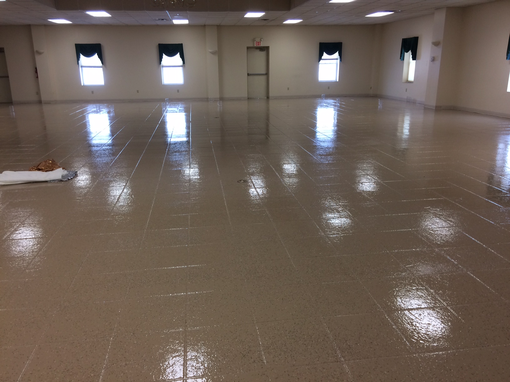 8000 sq ft banquet hall floor coated over existing tile by first-time users