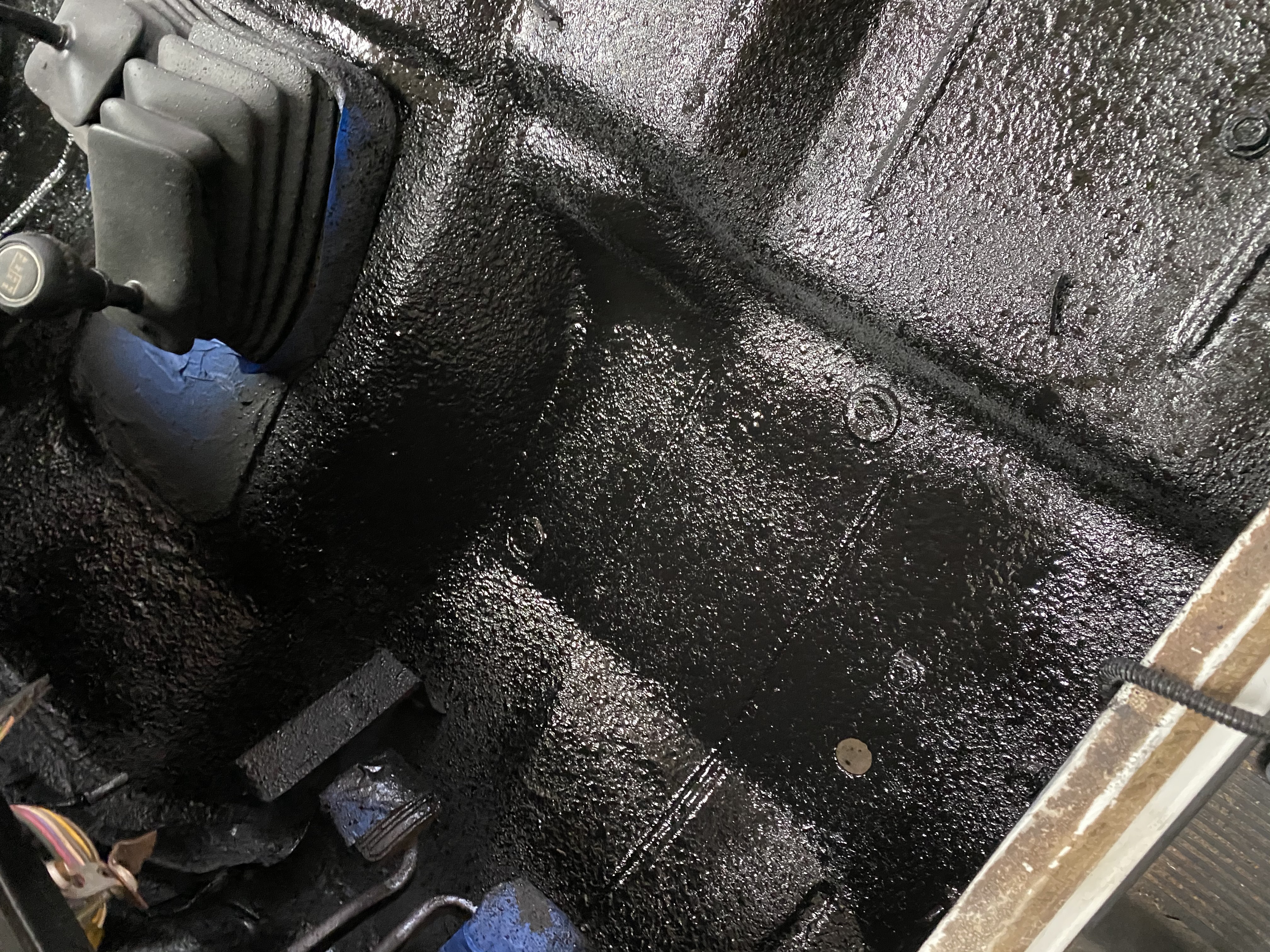 AG603X epoxy bed liner applied to a heavy equipment cab floor for a durable non-skid surface