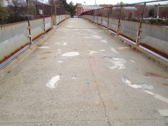 Weathered pedestrian bridge deck before sealing