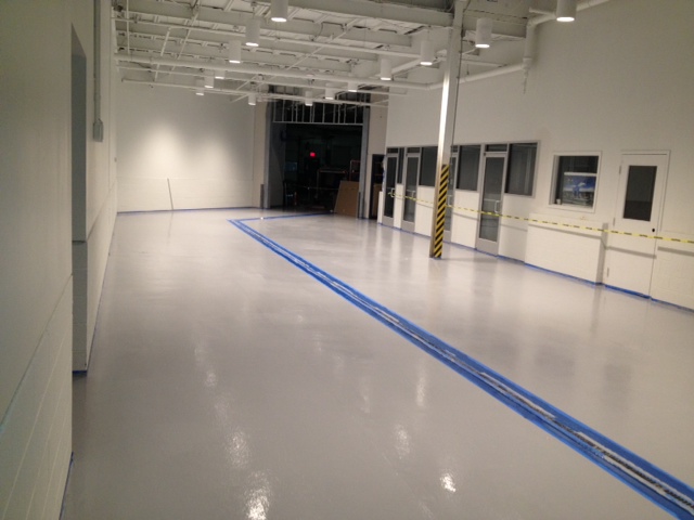 Finished ArmorGarage commercial epoxy floor at a dealership service area