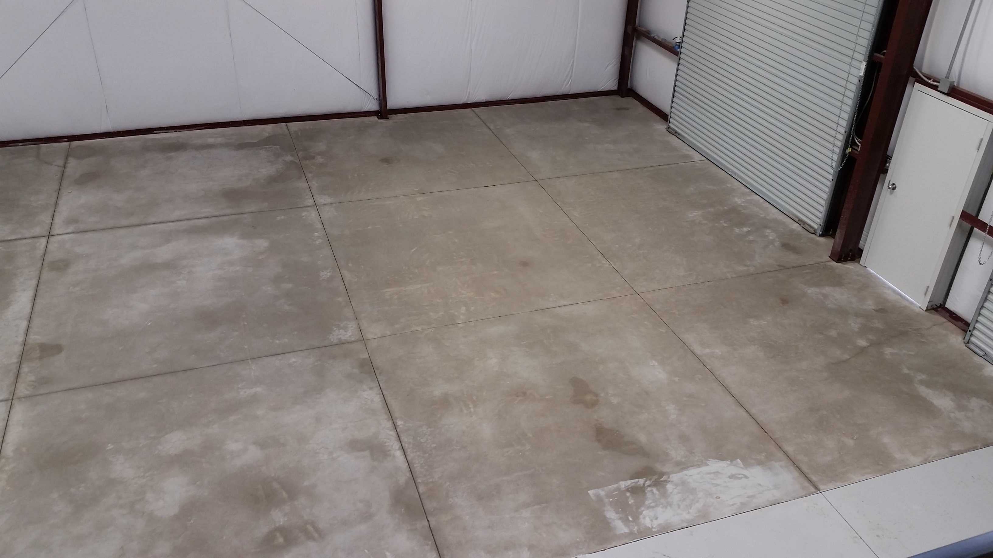 Worn commercial concrete floor before recoating