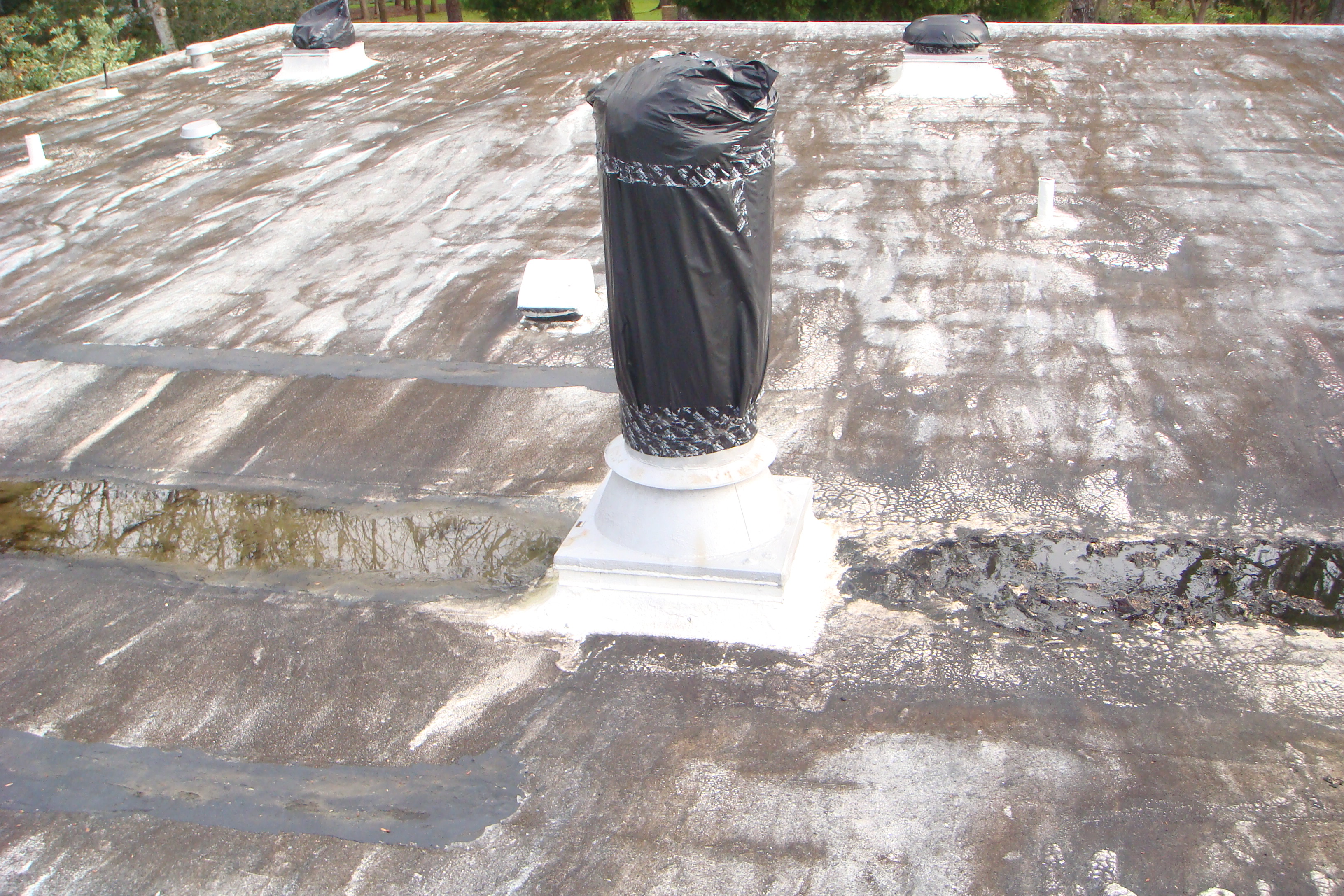 Roof penetrations and seams properly flashed with ArmorGarage Roof Repair Mastic, forming a permanent watertight bond